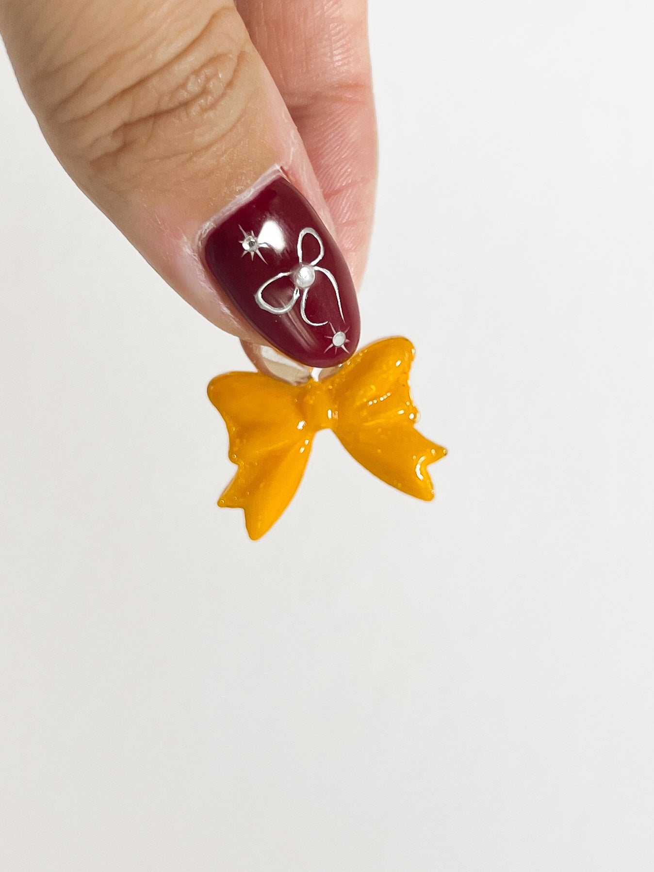 Bonbon Earrings — Bow ୨୧